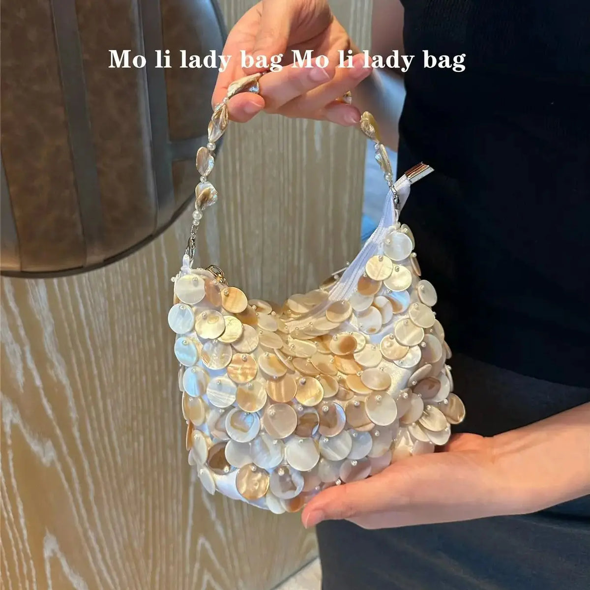 Disc-Embellished Crescent Shoulder Bag