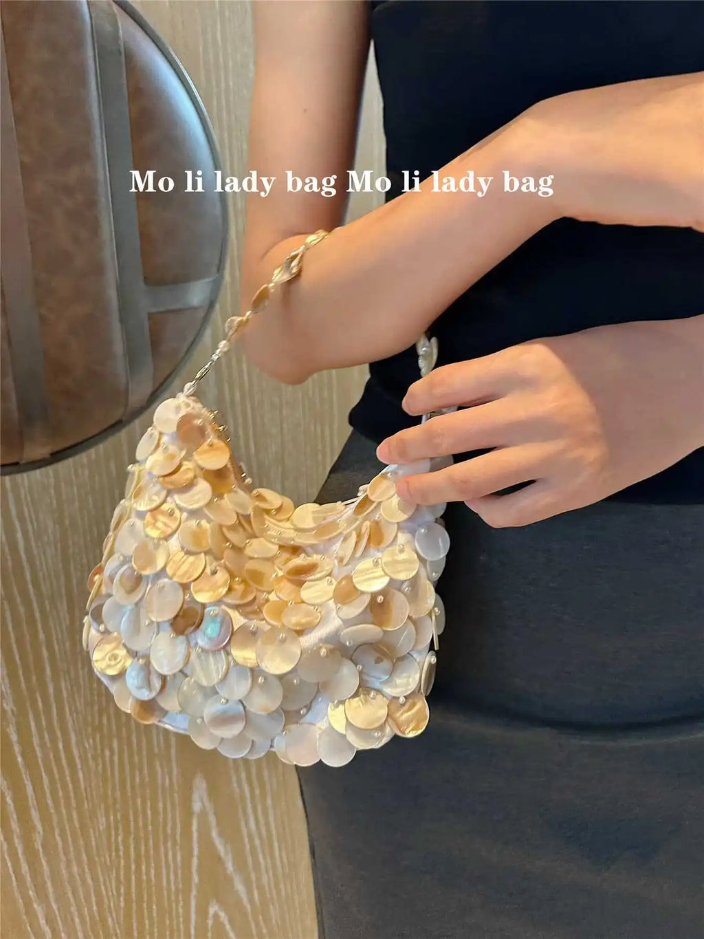 Disc-Embellished Crescent Shoulder Bag