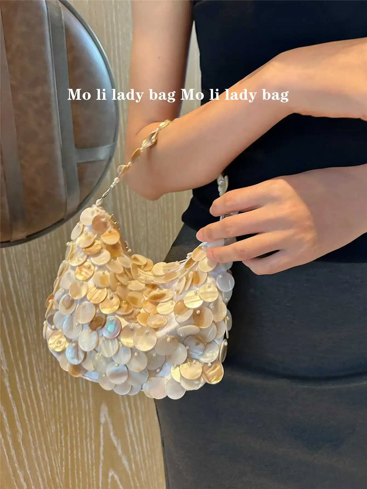 Disc-Embellished Crescent Shoulder Bag