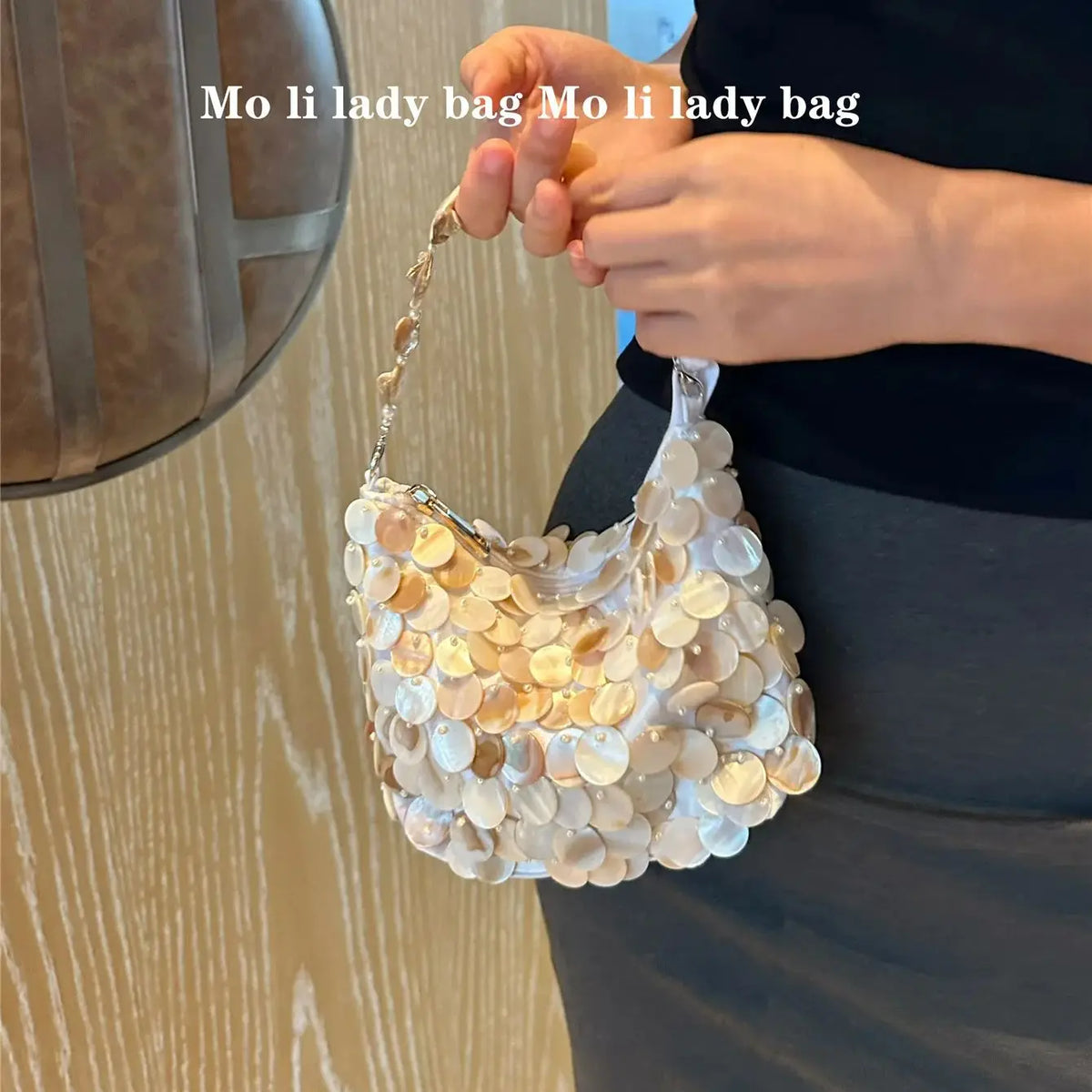 Disc-Embellished Crescent Shoulder Bag