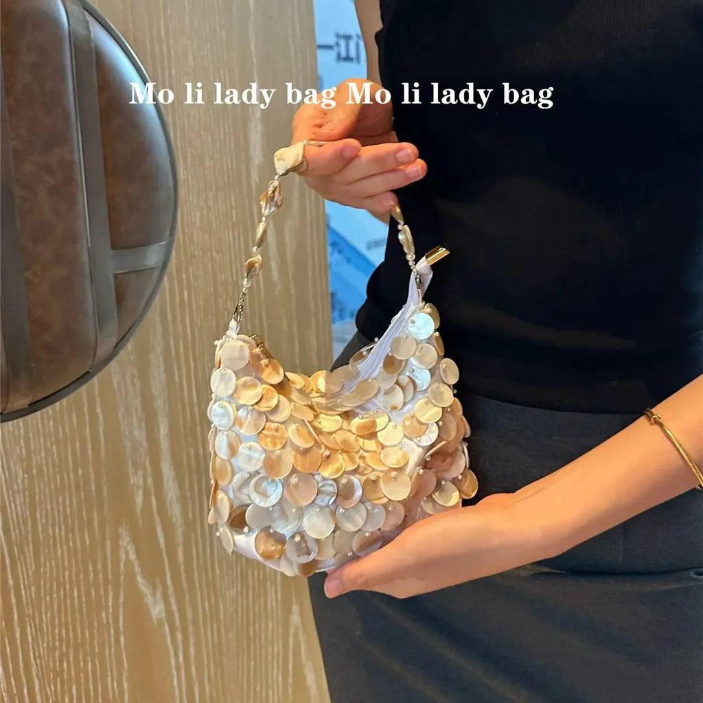 Disc-Embellished Crescent Shoulder Bag