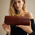Croc-Embossed Cylinder Clutch Bag