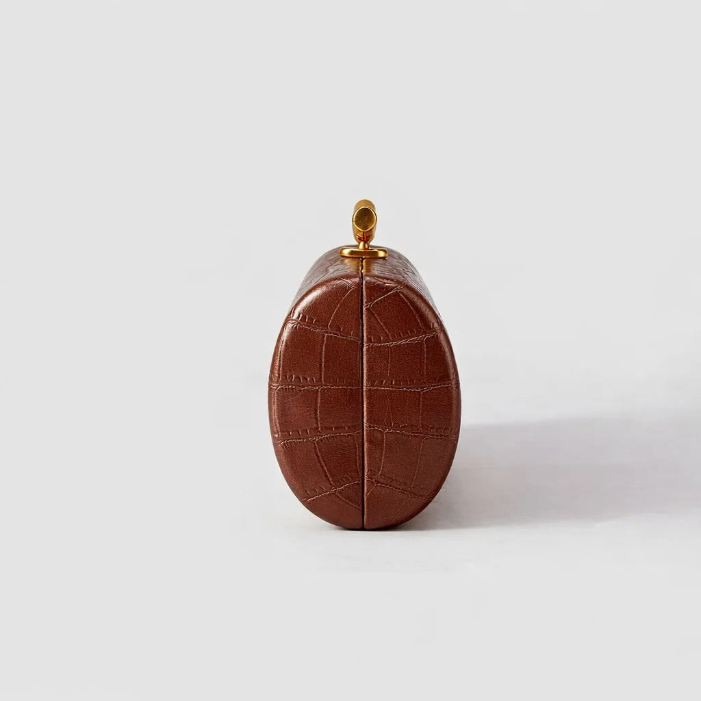 Croc-Embossed Cylinder Clutch Bag