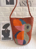 Abstract-Motif Woven Bucket Bag