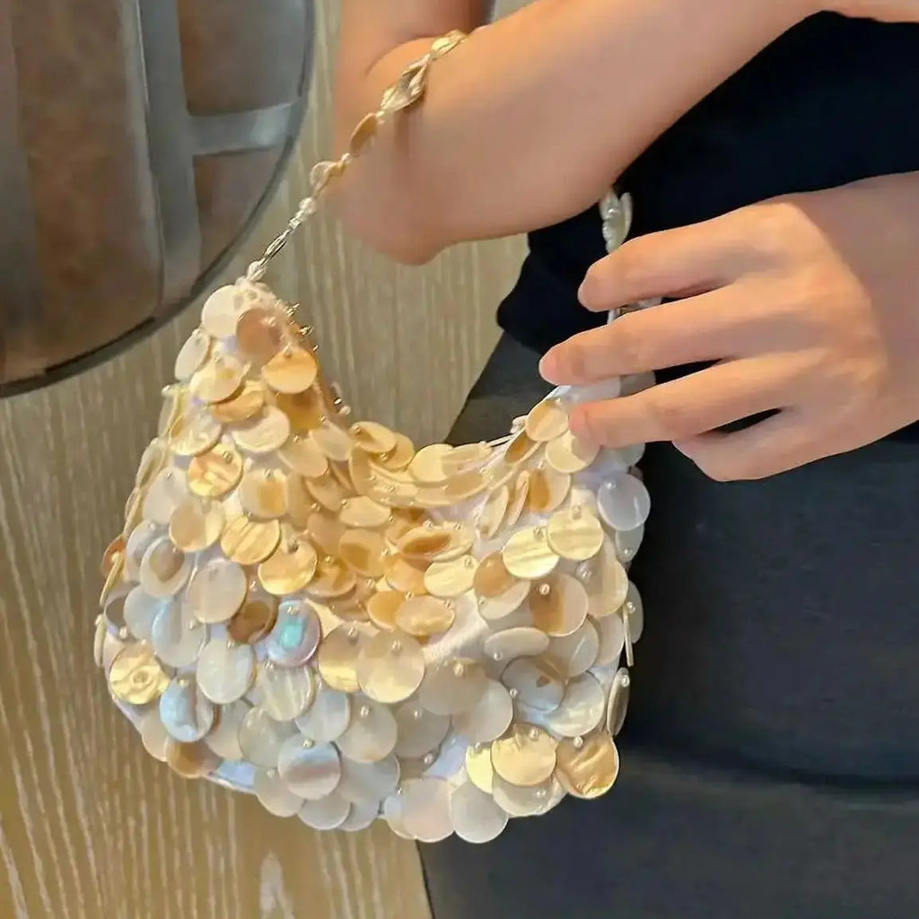 Disc-Embellished Crescent Shoulder Bag